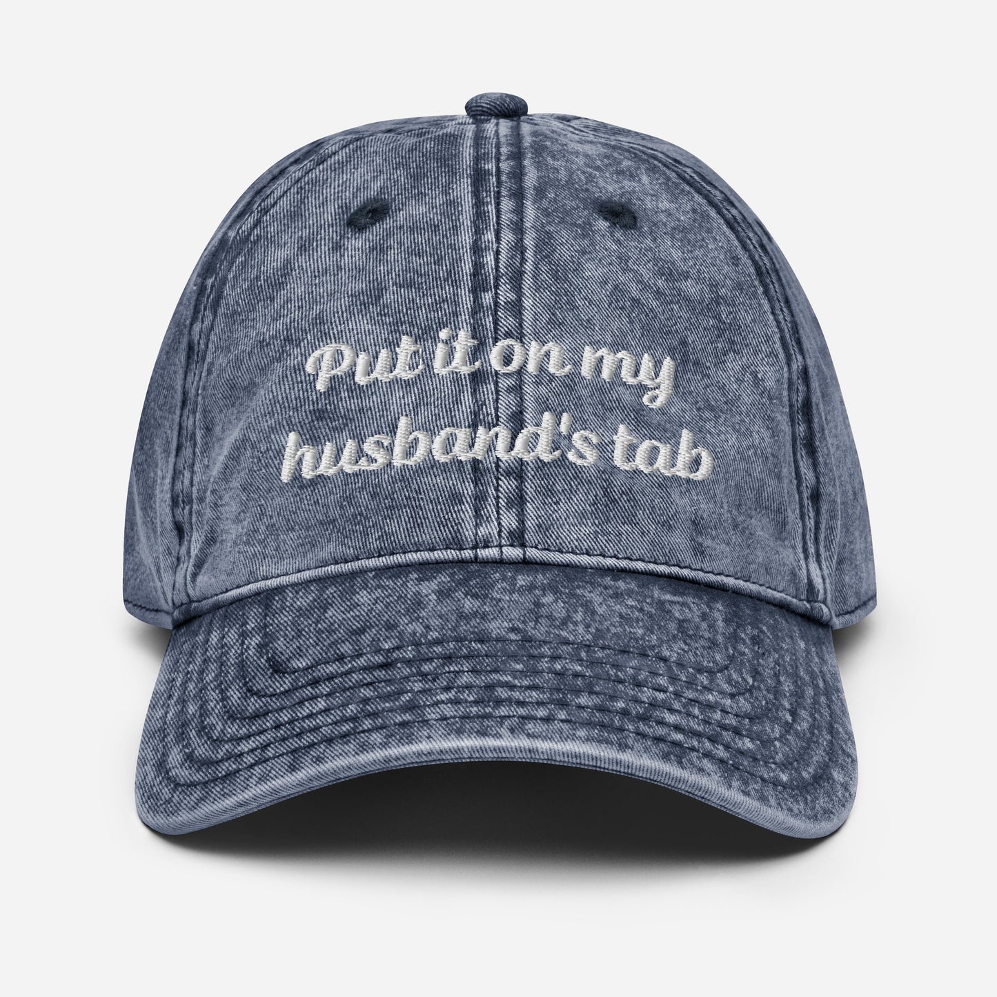 Vintage denim dad hat with &quot;Put it on my husband&#39;s tab&quot; embroidery. Funny, sarcastic, and perfect for gifts. Great for vintage style and versatile wear.