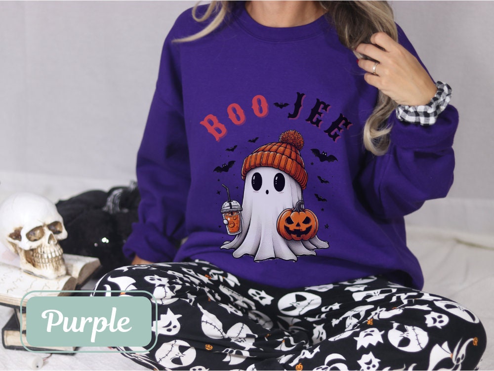 Purple &#39;Boo Jee&#39; Halloween sweatshirt with a ghost holding a pumpkin and coffee. Ideal for Halloween teachers, women’s Halloween outfits, and spooky parties. This spooky sweatshirt is a perfect gift for mom, grandma, nurse, teacher, or wife.