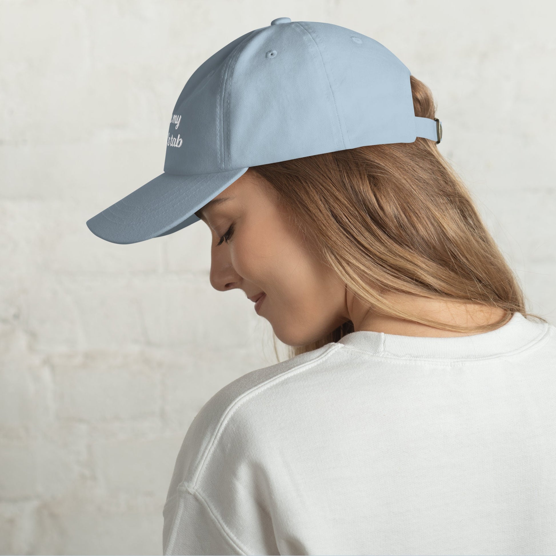 Light blue classic dad hat with &quot;Put it on my husband&#39;s tab&quot; embroidery. Funny, sarcastic, and perfect for gifts. Great for vintage style and versatile wear.