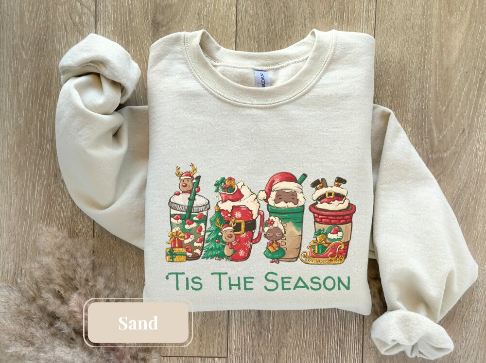 Enjoy the festive charm with our sand-colored Christmas sweatshirt, showcasing a unique Christmas latte tee design, great as a teacher&#39;s holiday outfit or a fun Xmas shirt.