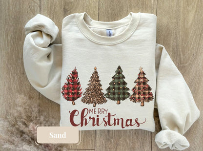 Sand-colored holiday sweatshirt with festive Christmas trees and &#39;Merry Christmas&#39; text. Perfect tree sweatshirt, Christmas gift, winter shirt, and holiday sweatshirt for the Christmas squad. Cozy Christmas crewneck for holiday gatherings.