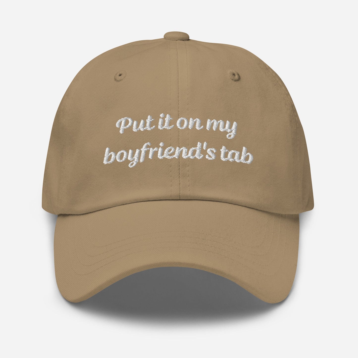 A stylish tan khaki dad hat with embroidered text, &quot;Put it on my boyfriend&#39;s tab,&quot; perfect as a funny gift for your girlfriend. This sarcasm-infused baseball cap adds an aesthetic touch to any outfit.