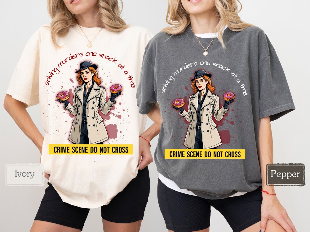 Comparison of Ivory and Pepper shirts featuring a detective with donuts and the slogan &#39;solving murders one snack at a time.&#39; Great for murder mystery lovers, true crime fans, and anyone who enjoys crime shows and snacks.