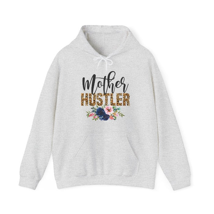 Celebrate motherhood with the ‘Mother Hustler’ hooded sweatshirt, featuring a beautiful blend of floral design and modern typography, a warm Mother's Day gift for cherished moms – available now at D1gital Emporium US.