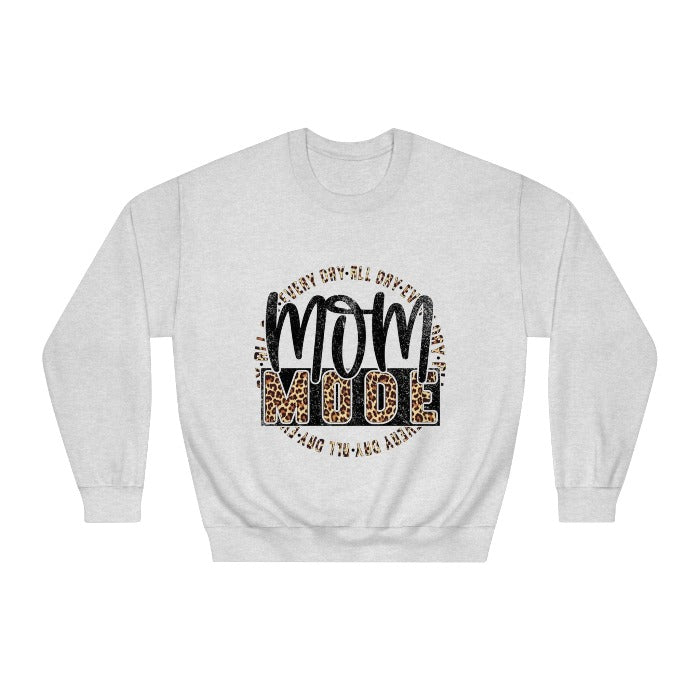 Get ready for comfort in 'Mom Mode' with this cozy crewneck sweatshirt featuring bold lettering, perfect for Mother's Day lounging or everyday chic – available now at D1gital Emporium US.