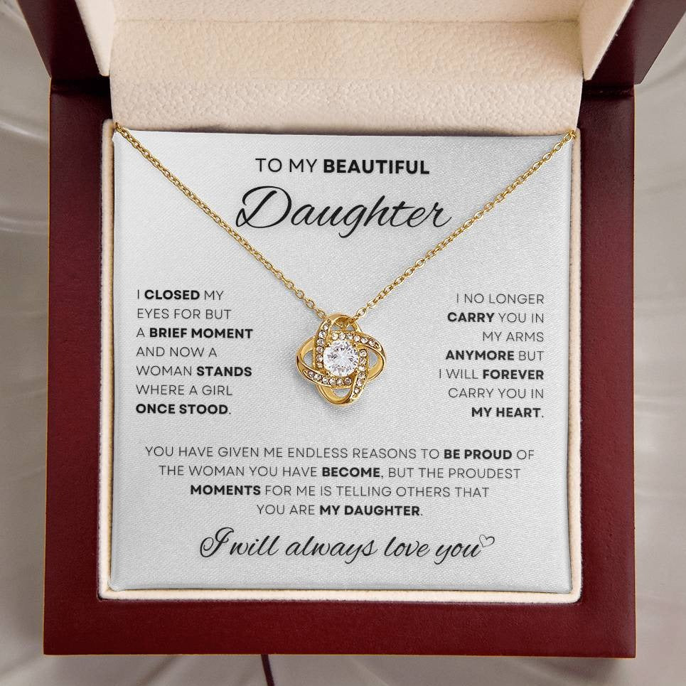 Gold Love Knot Necklace for a daughter with an emotional message from dad, displayed in a luxurious cream and maroon gift box, symbolizing lifelong love and connection.