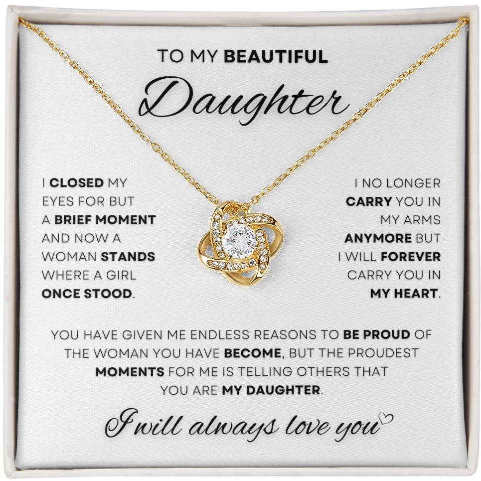 Gold Love Knot Necklace with a heartfelt inscription for a daughter, encased in an elegant box - a symbol of a father's endless love and pride.