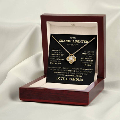 Elegant gold-plated Loveknot necklace presented in a mahogany gift box with a touching message from grandmother to granddaughter, capturing the essence of family love and legacy.
