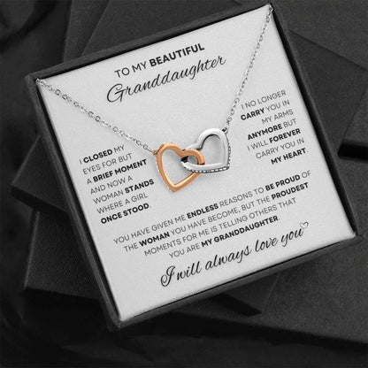Express your everlasting love with this elegant 'I Will Always Love You' Heart Necklace for granddaughters, featuring intertwined hearts in polished steel and rose gold, symbolizing a bond that grows stronger with time. A timeless gift available at D1gital Emporium US.