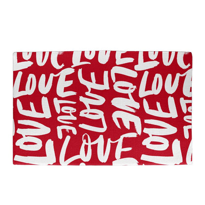Vibrant red Valentine's Day doormat with 'LOVE' lettering in various white fonts, a welcoming gesture for any entrance. Shop now at D1gital Emporium US for this affectionate home accessory.