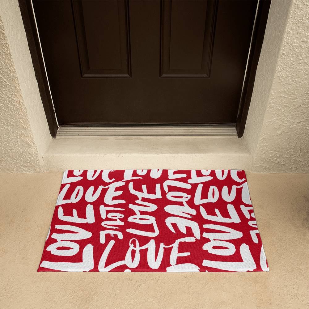 Charming red and white 'LOVE' themed doormat positioned at a home's entrance, perfect for Valentine's Day decor. Available for a warm welcome at D1gital Emporium US.