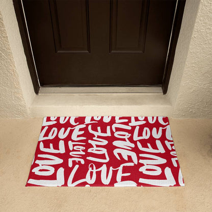 Charming red and white 'LOVE' themed doormat positioned at a home's entrance, perfect for Valentine's Day decor. Available for a warm welcome at D1gital Emporium US.