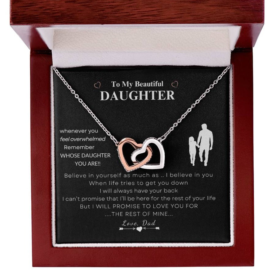 Silver and rose gold interlocking hearts necklace in a mahogany box with a father's loving message to his daughter, the perfect gift to reaffirm her strength and worth.
